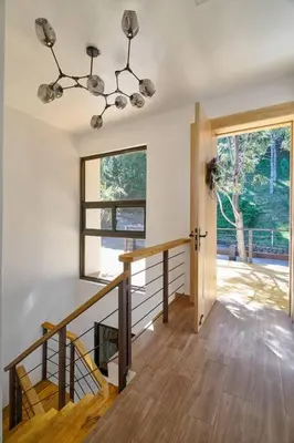 a room with a staircase and a window at Villa Favella-Pop-Art-View-7BR-Jamaca De Dios-Balcony-Dream in Jarabacoa