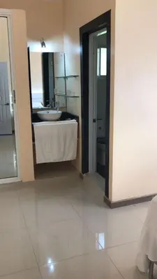 a bathroom with a sink and a mirror at Beautiful Villa in Boca Chica in Boca Chica