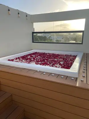 a bed in a room with a large window at Studio 27 in Santo Domingo