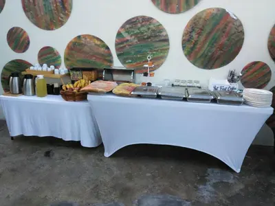 a white table with food on it next to a wall at Studio 27 in Santo Domingo