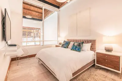 a bedroom with a bed and a window at Golf View Apt at Casa De Campo in El Infiernito