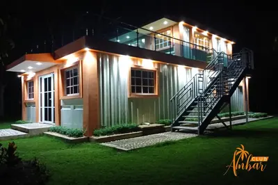 a house with a staircase in front of it at night at Villas Club Ámbar in Cacique