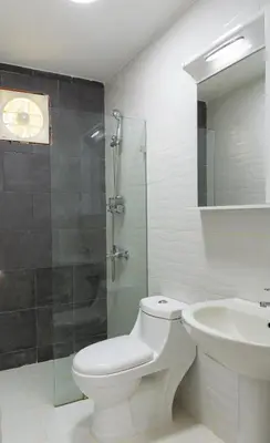 a bathroom with a toilet and a sink and a shower at Villas Club Ámbar in Cacique