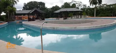 a swimming pool with blue water in a resort at Villas Club Ámbar in Cacique