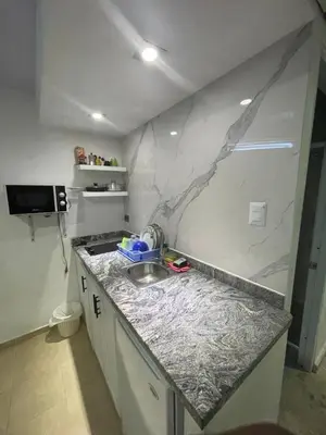 a kitchen with a sink and a counter top at Mar azul puerto plata in San Felipe de Puerto Plata