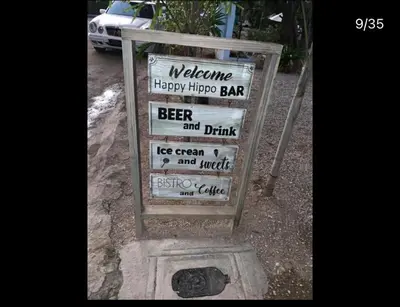 a sign for a beer and drinking establishment at Mar azul puerto plata in San Felipe de Puerto Plata