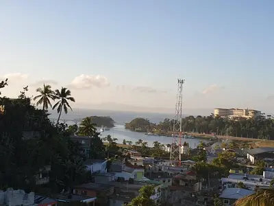 a view of a city and a body of water at Samana house in Santa Bárbara de Samaná