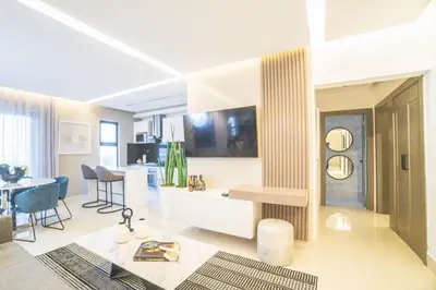 a living room with a kitchen and a dining room at SOHA PANORAMA in Santiago de los Caballeros