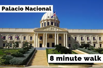 a large building with a clock tower on top of it at Hotel Enrique I Gazcue, Bed and Breakfast in Santo Domingo