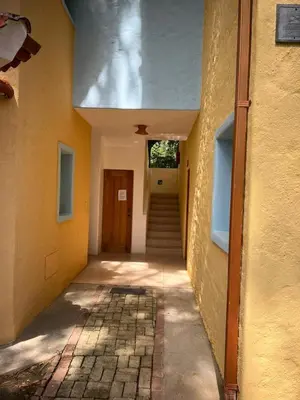 a hallway of a building with a door and stairs at Hermoso apartamento de playa en perla marina Sosua - Cabarete in Sosúa