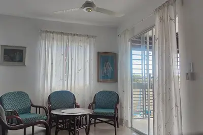a room with chairs and a table and a window at Minerva in La Ureña
