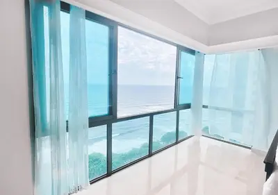 an ocean view from a room with large windows at Exclusive 3 BDR, Gym & Pool, SeaView, Luxury Tower in Santo Domingo
