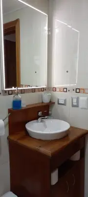 a bathroom with a sink and a mirror at Room beach-front with private bathroom -Adults only in Punta Cana