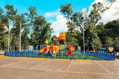 a playground with a slide in a park at Apartamento Hogareño in Jarabacoa