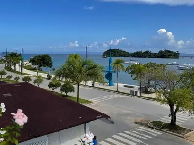 a view of the ocean from the balcony of a resort at Indy's Best Bay FrontView in Samana. in Santa Bárbara de Samaná