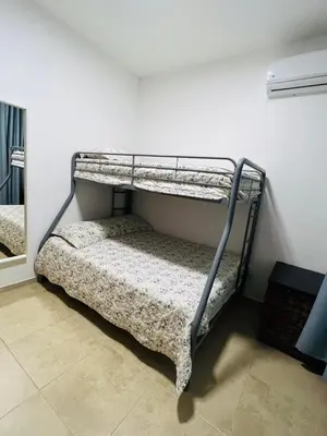 a bedroom with two bunk beds in a room at Lovely Beachfront 2 bedrooms condo with 2 pools in Las Terrenas