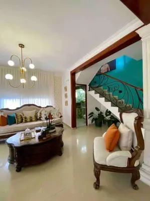 a large living room with a couch and a table at Beautiful Penthouse in La Vega, RD in Concepción de La Vega