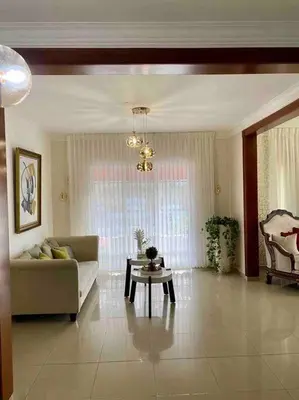 a living room with a couch and a table at Beautiful Penthouse in La Vega, RD in Concepción de La Vega