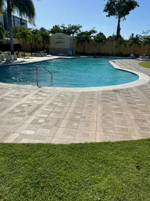 a swimming pool with blue water in a resort at Sweet Home in Santiago de los Caballeros