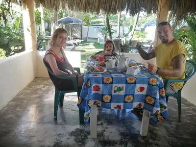 a group of people sitting at a table at El Conde del Macao in Salado