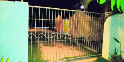 a gate with a bird inside of it at El Conde del Macao in Salado