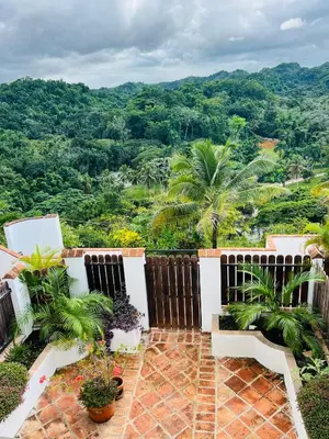a balcony with a view of the mountains at Piece of Paradise in Las Terrenas
