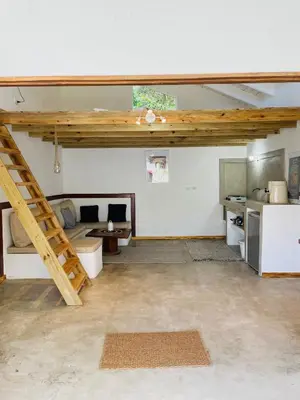 a large room with a loft with a staircase at Villa Tortuga, Guest house Private bungalow, private pool in Las Terrenas