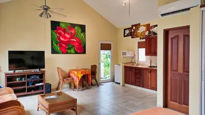 a living room with a table and a kitchen at Ocean Dream 1st See Line Studio in Cabarete