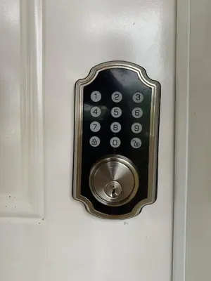 a door lock with a remote control in it at Ocean Dream 3d floor studio w/balcony in Cabarete