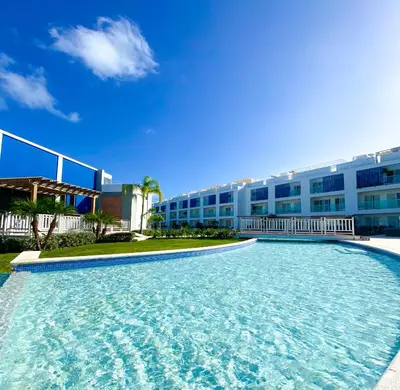 a large swimming pool in front of a building at Xeliter Cana Rock Punta Cana in Punta Cana