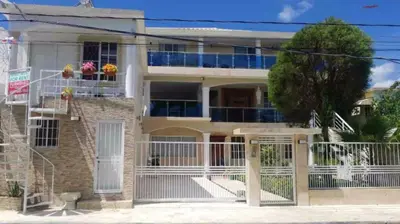 an image of a house with a gate at Fully Equipped New 2br Apt-dt2mins To The Beach in Sosúa