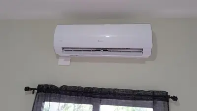 a room with a window with a air conditioner and a window curtain at Cabrera Family Villa in Cabrera