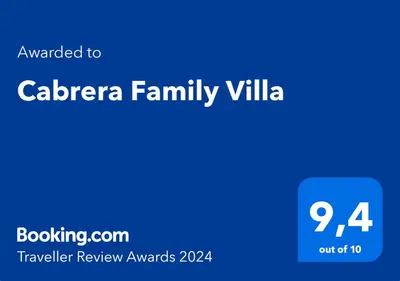 a blue sign with the words calera family villa at Cabrera Family Villa in Cabrera