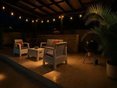 a patio with chairs and a table and lights at Fully Equipped 2br Apt-dt5mins To The Beach in Sosúa