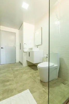 a bathroom with a toilet and a sink at Skylight Suites Hotel in San Felipe de Puerto Plata