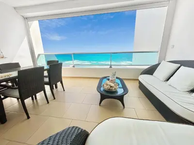 a living room with a couch and a table at 707 Marbella 2bedroom Beachfrom Apt in San Pedro de Macorís