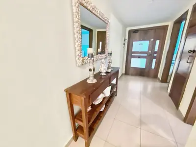 a bathroom with a vanity and a mirror at 707 Marbella 2bedroom Beachfrom Apt in San Pedro de Macorís