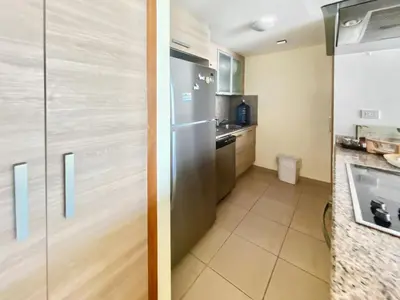 a kitchen with a stainless steel refrigerator and a counter at 707 Marbella 2bedroom Beachfrom Apt in San Pedro de Macorís