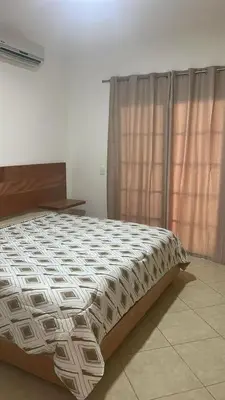 a large bed in a room with a window at Villa 102A, 5 master bedroom and 5 full bathrooms with private pool in Sosúa