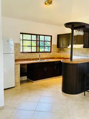 a kitchen with a island in the middle of it at Hispaniola 3 bed, 3 bath Villa with pool & jacuzzi in Sosúa