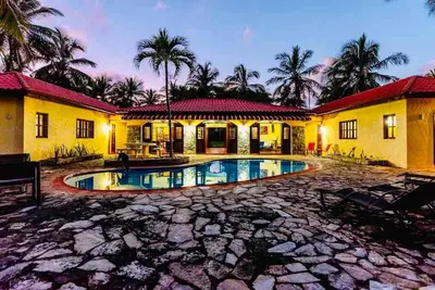 a house with a swimming pool in front of it at PALM HOUSE - LUXURY VILLA - SAMANÁ - Ocean Front in Sánchez