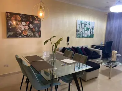 a living room with a table and a couch at Lesnah Apartamento, Jacobo Majluta in Los Casabes