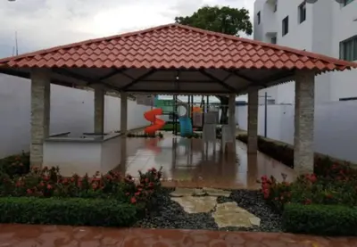 a gazebo in the rain with a playground at Comodas 3 Habitaciones, Wifi 1er piso in Santiago de los Caballeros