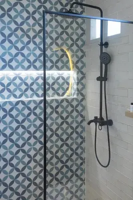 a shower with a glass door in a bathroom at Casa Adefra Boutique Hotel Zona Colonial in Santo Domingo