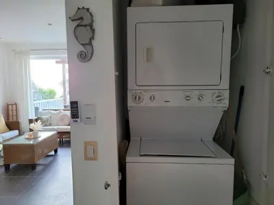 a kitchen with a stove top oven next to a living room at Perfect Paradise, Oceanview in Samana in Santa Bárbara de Samaná