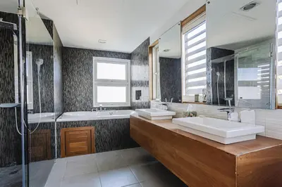 a bathroom with two sinks and a tub and a shower at Ultravioleta Boutique Residences in Cabarete