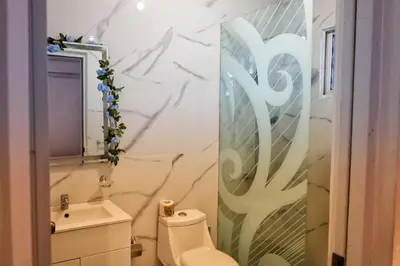 a bathroom with a toilet and a sink at Casa familiar in San Pedro de Macorís