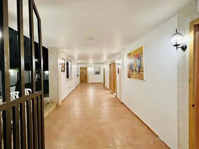 a hallway with white walls and a tile floor at Noé Hotel ,1 Bedroom # 5 near to the beach in Punta Cana
