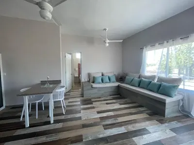 a living room with a couch and a table at Apartamentos La Torre in Río San Juan