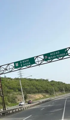 a highway with a green sign on the freeway at Villa La Esperanza in Nizao